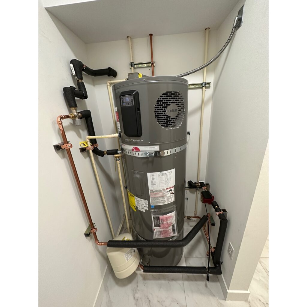 Water heater replacement in a tight Eastside utility closet with insulated copper lines and expansion tank